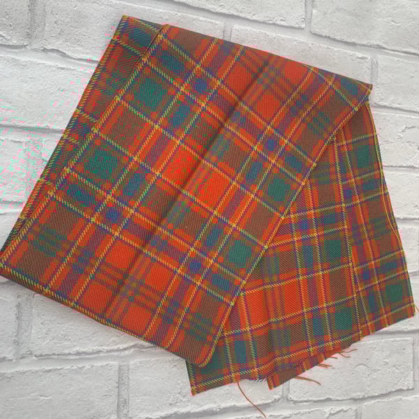 Orange tartan fabric offcut