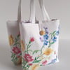 Little bucket bag or handbag upcycled from floral vintage embroidery