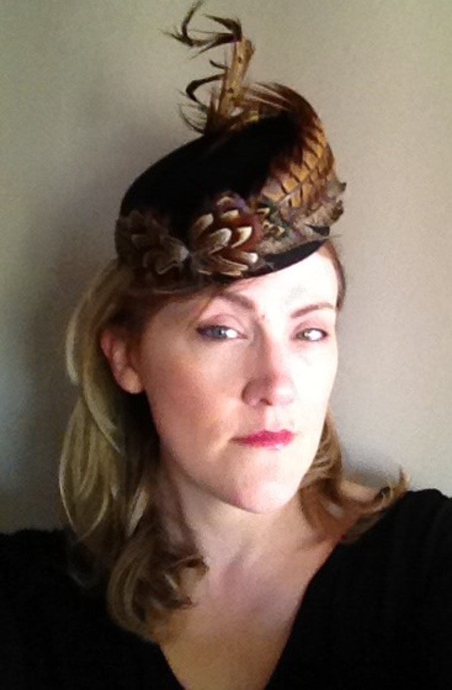 Black felt hat, fascinator trimmed with hand curled pheasant feathers