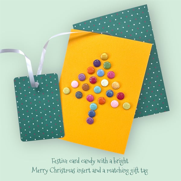 Christmas card of a bright multicoloured glittery tree with a matching gift tag