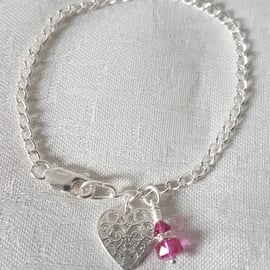 Gorgeous Sterling Silver bracelet with Swarovski crystals in Fuchsia Pink.