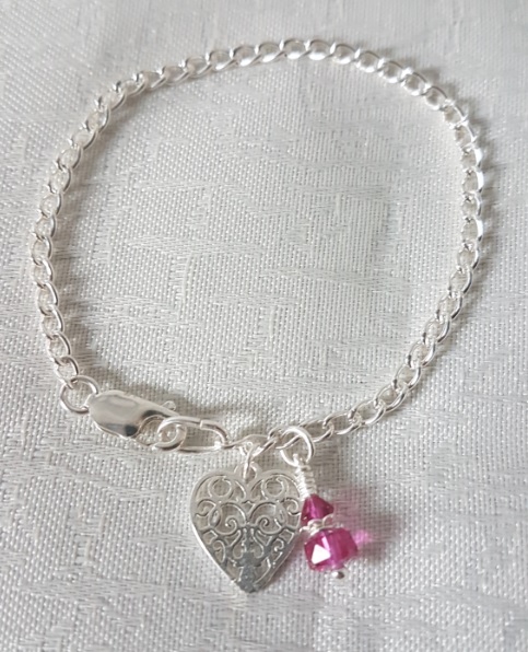 Gorgeous Sterling Silver bracelet with Swarovski crystals in Fuchsia Pink.