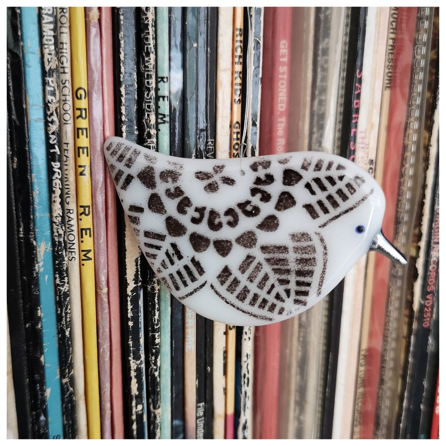 small black and white glass bird