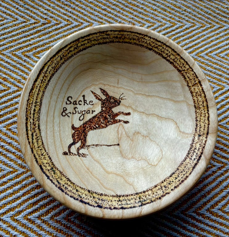 Wooden bowl with a witche's familiar