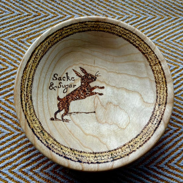 Wooden bowl with a witche's familiar
