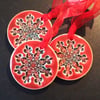 red ceramic snowflake decorations