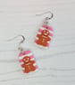 Pink and white striped gingerbread men earrings - Image 1