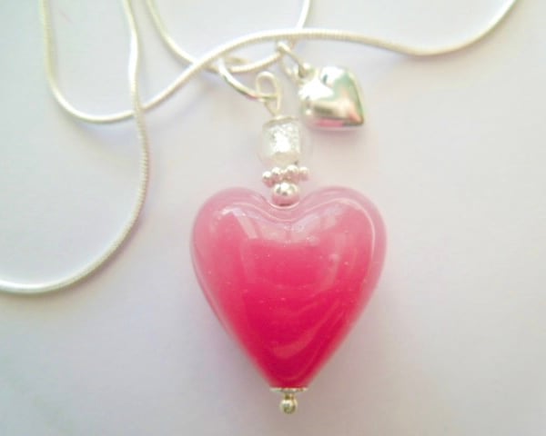 Murano glass pink heart pendant handmade with sterling silver charm and chain.