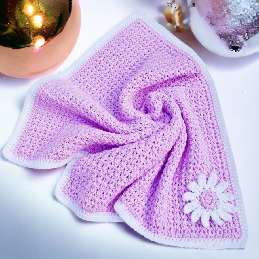 Crochet baby blanket in lilac with puff white daisy applique