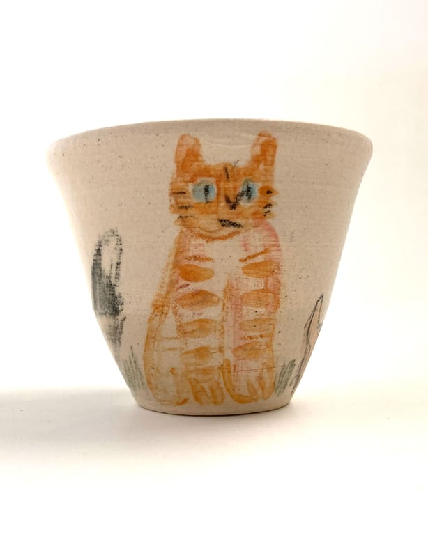 Small cup with dogs and a cat