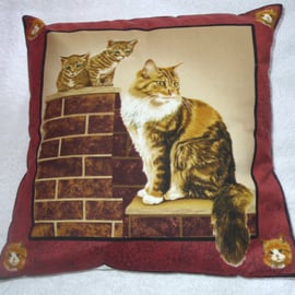 Lovely fluffy brown and white cat and kittens on a garden wall cushion