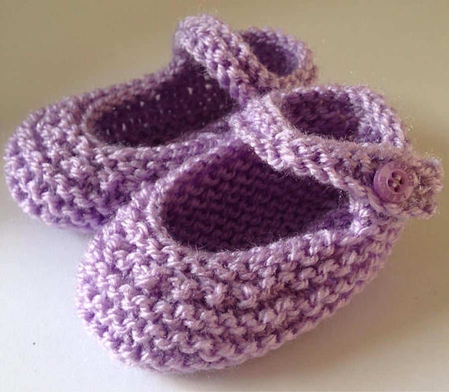 Hand knitted baby booties in lilac