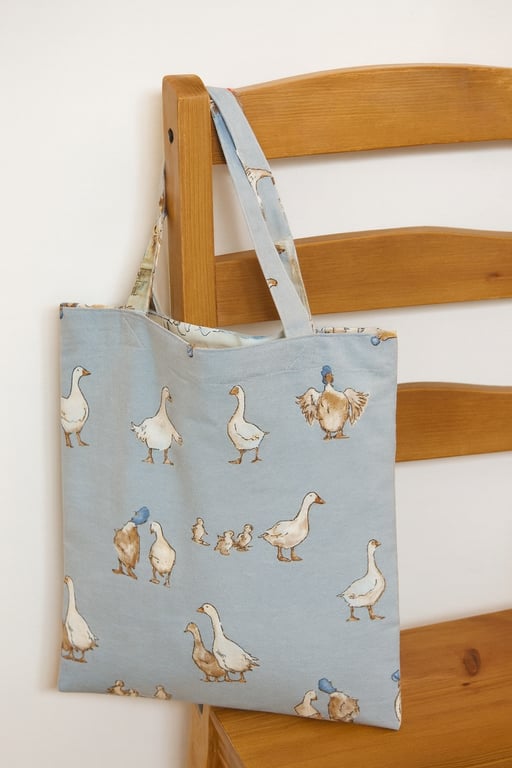 DUCKS ON BLUE SUSTAINABLE UNLINED TOTE BAG