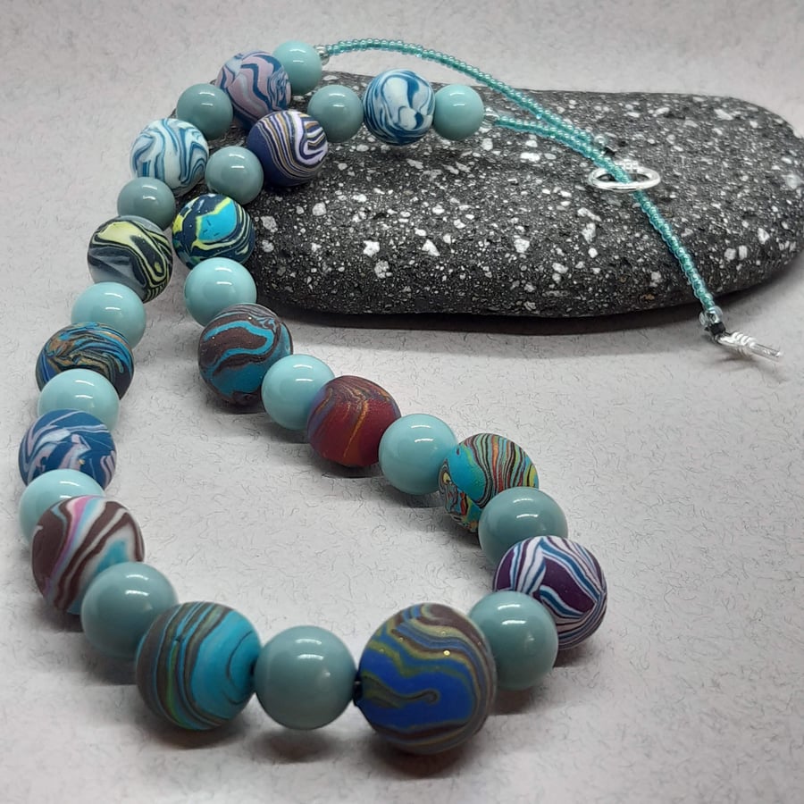 Unique polymer clay necklace in shades of blue