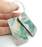 Rectangular shaped wooden earrings with a printed scribble effect design - Image 1