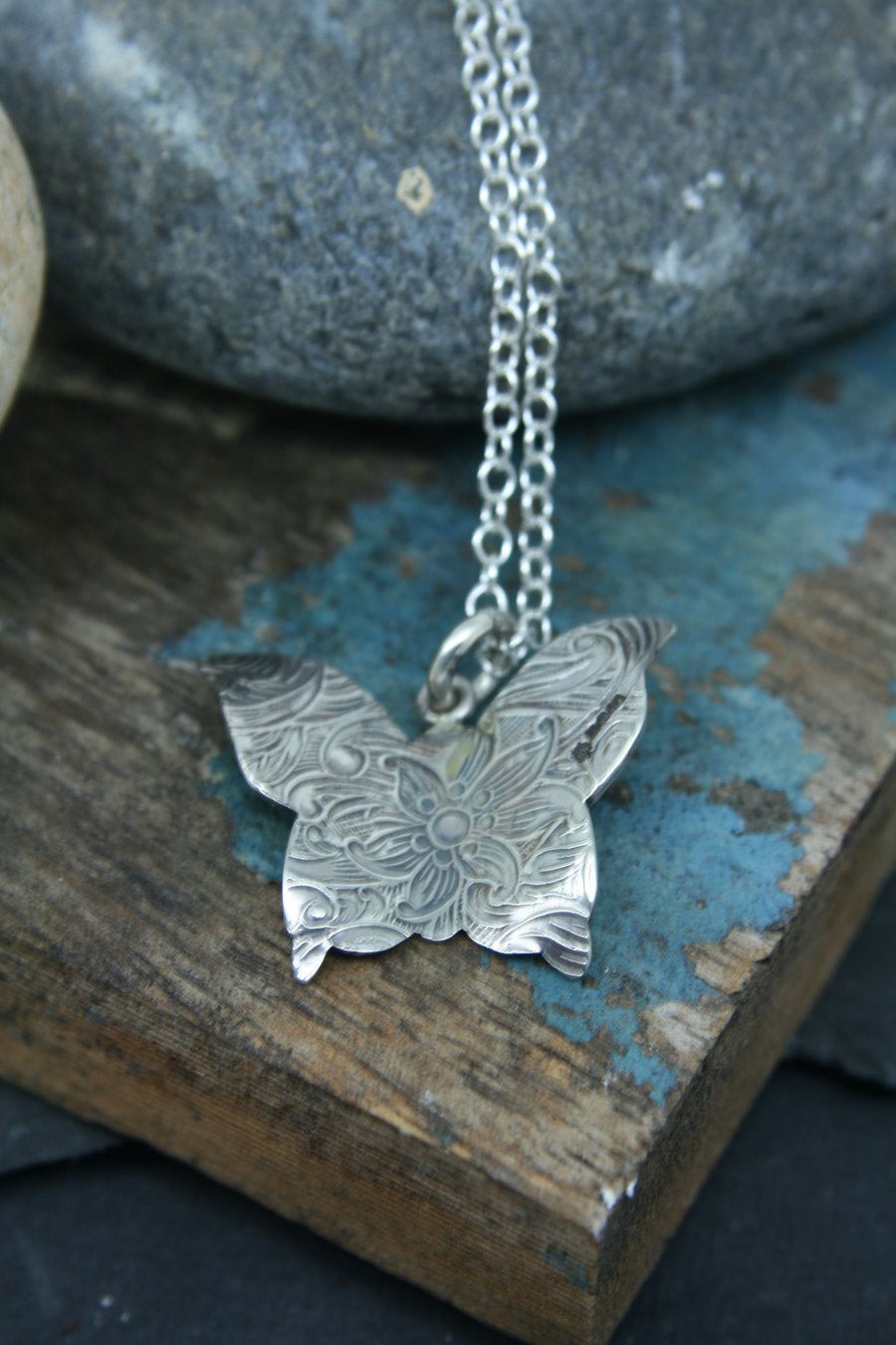 Paisley imprinted butterflysterling silver pendant