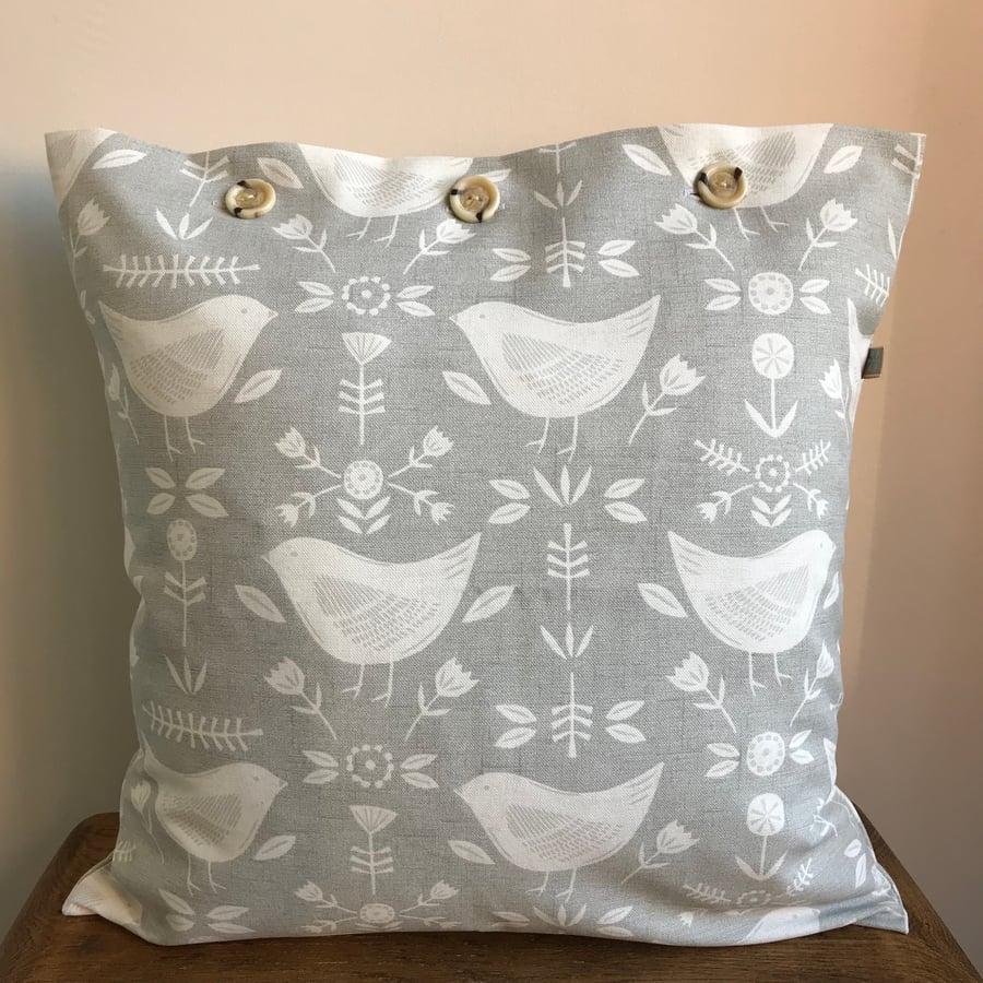 Pale grey bird cushion