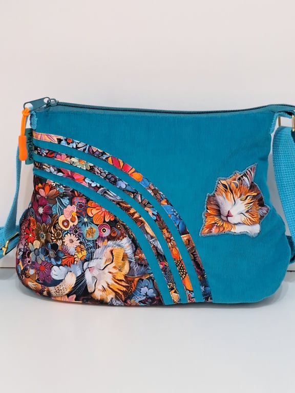 Blue handbag with sleeping cats and flowers 