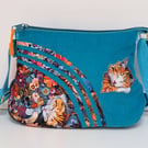 Blue handbag with sleeping cats and flowers 