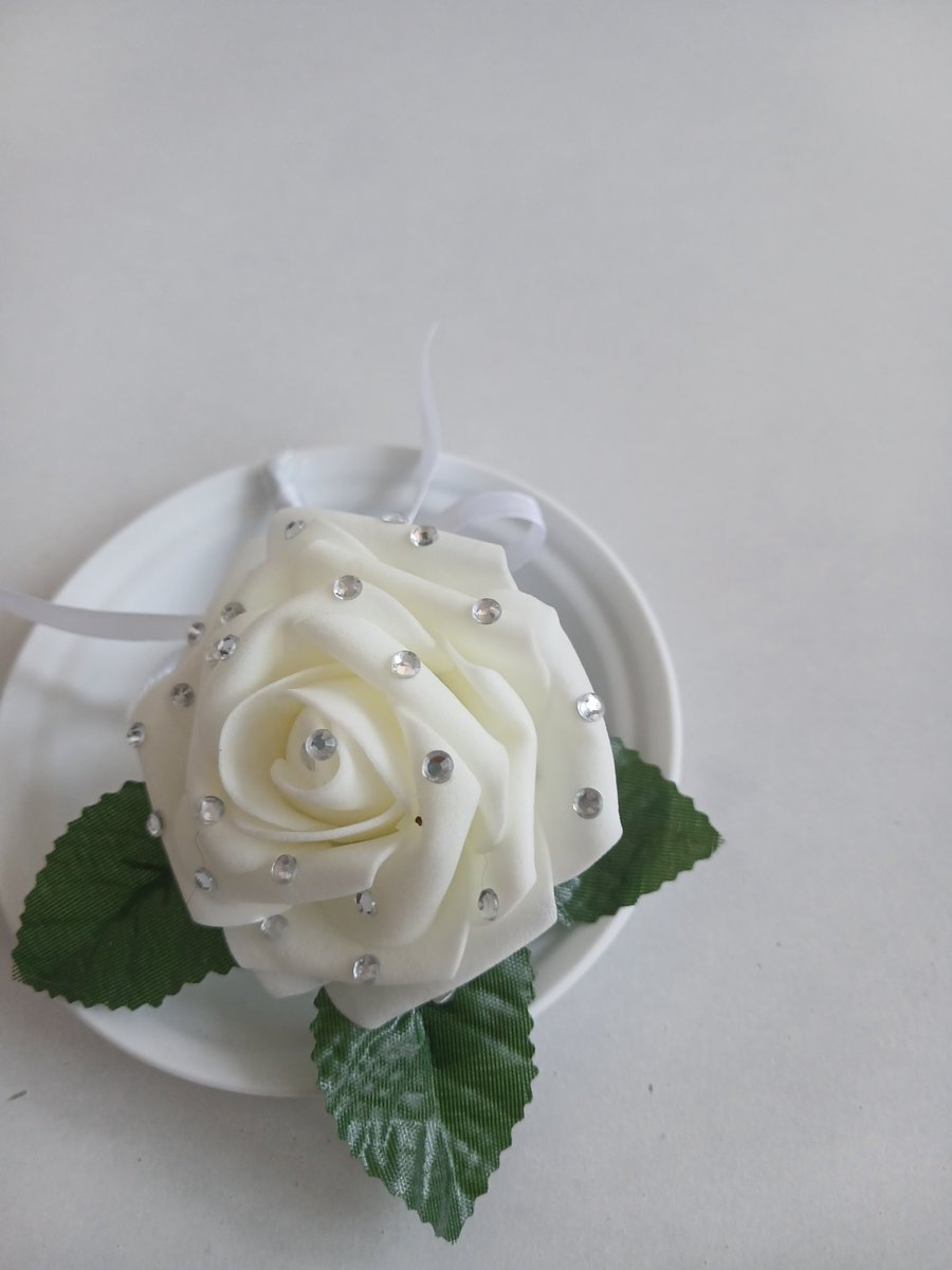 Cream rose buttonholes with a touch of sparkle to any occasion 