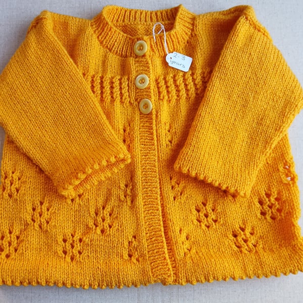 Handknitted child's cardigan.  Approx 2 to 3 years old. All proceeds to charity 