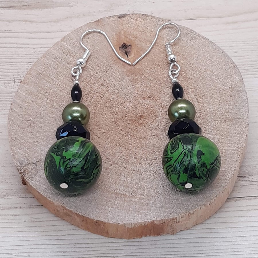 Forest green and black swirl dangly earrings
