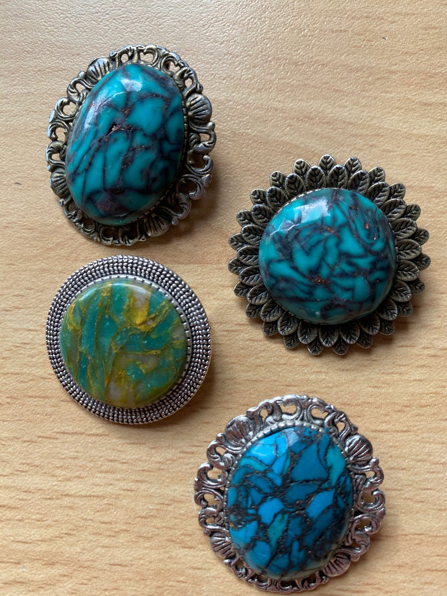 Faux stone brooches