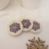 Set of three little purple snowflakes handmade ceramic decorations
