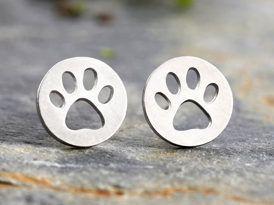 Hollow Pawprint Stud Earrings in Silver