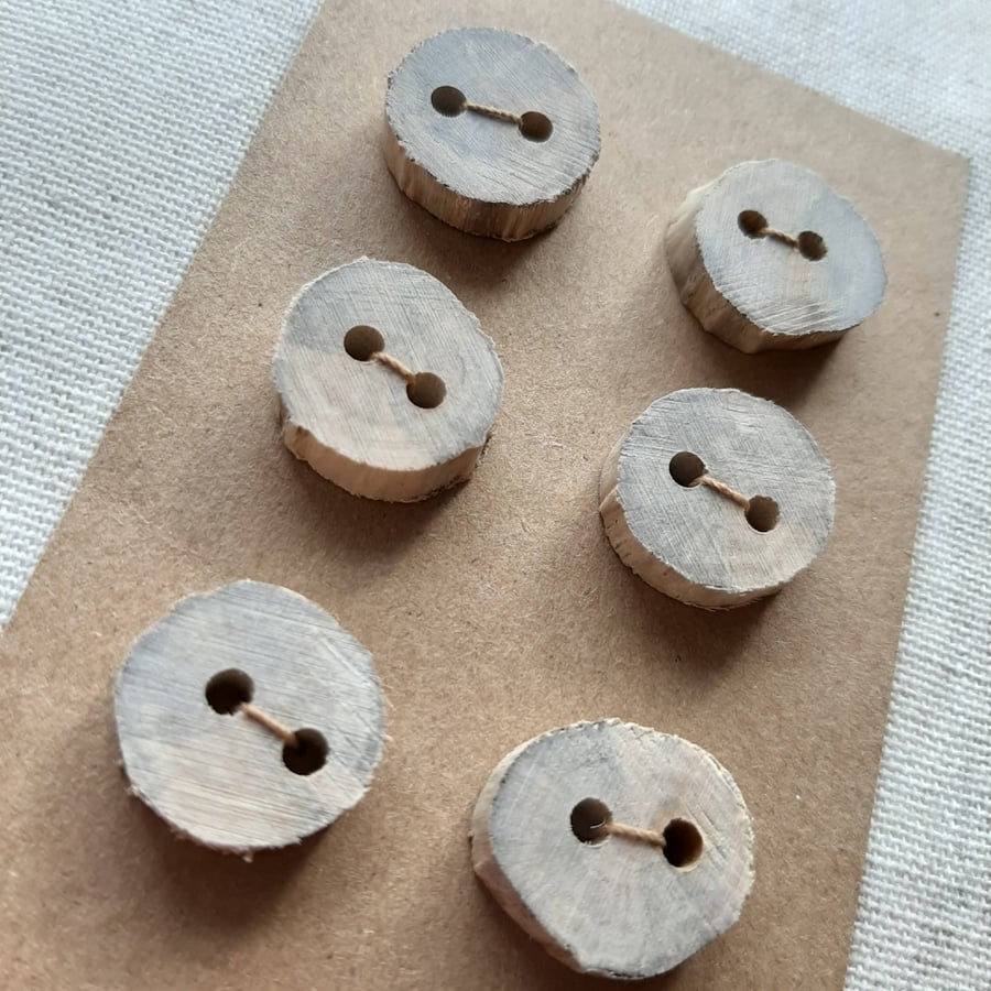 Set of six small flat driftwood buttons