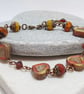 Rustic heart bracelet in red and dark yellow tones - Image 6