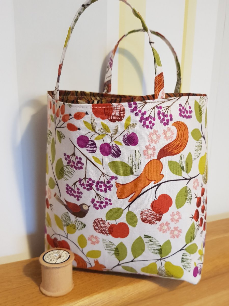 Reusable fabric gift bag: red squirrel after berries