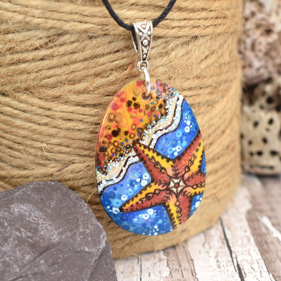 Along the seashore pyrography pendant. Starfish and waves on the beach.