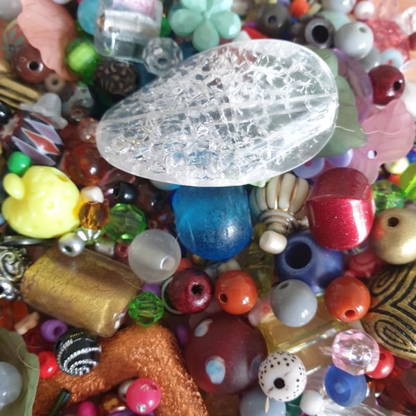 100 grams of mixed beads various colours shapes and sizes
