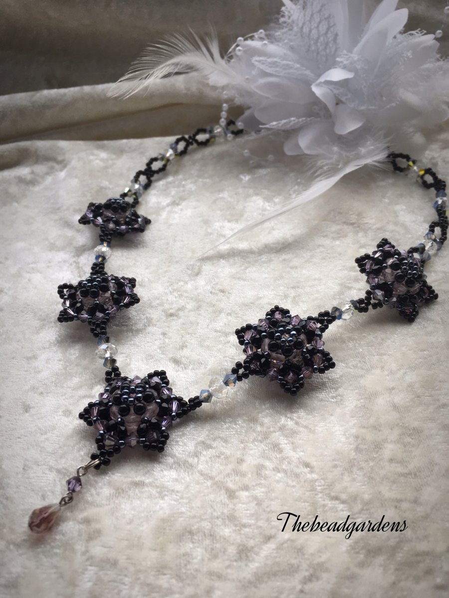 Black and violet star flower necklace 