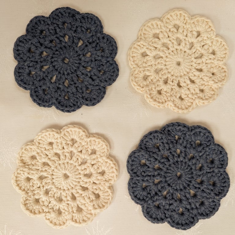 Set of 4 crochet coasters in denim blue and cream