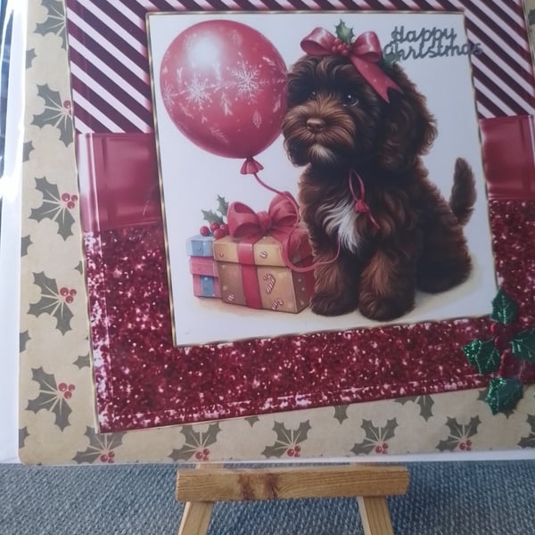 dog sat in the warm with his christmas presents