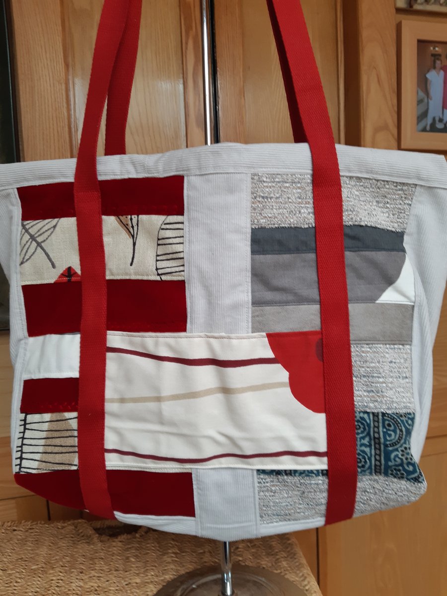 Grey and red patchwork zipped holdall