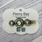 Gold and black hair clip, alligator clip