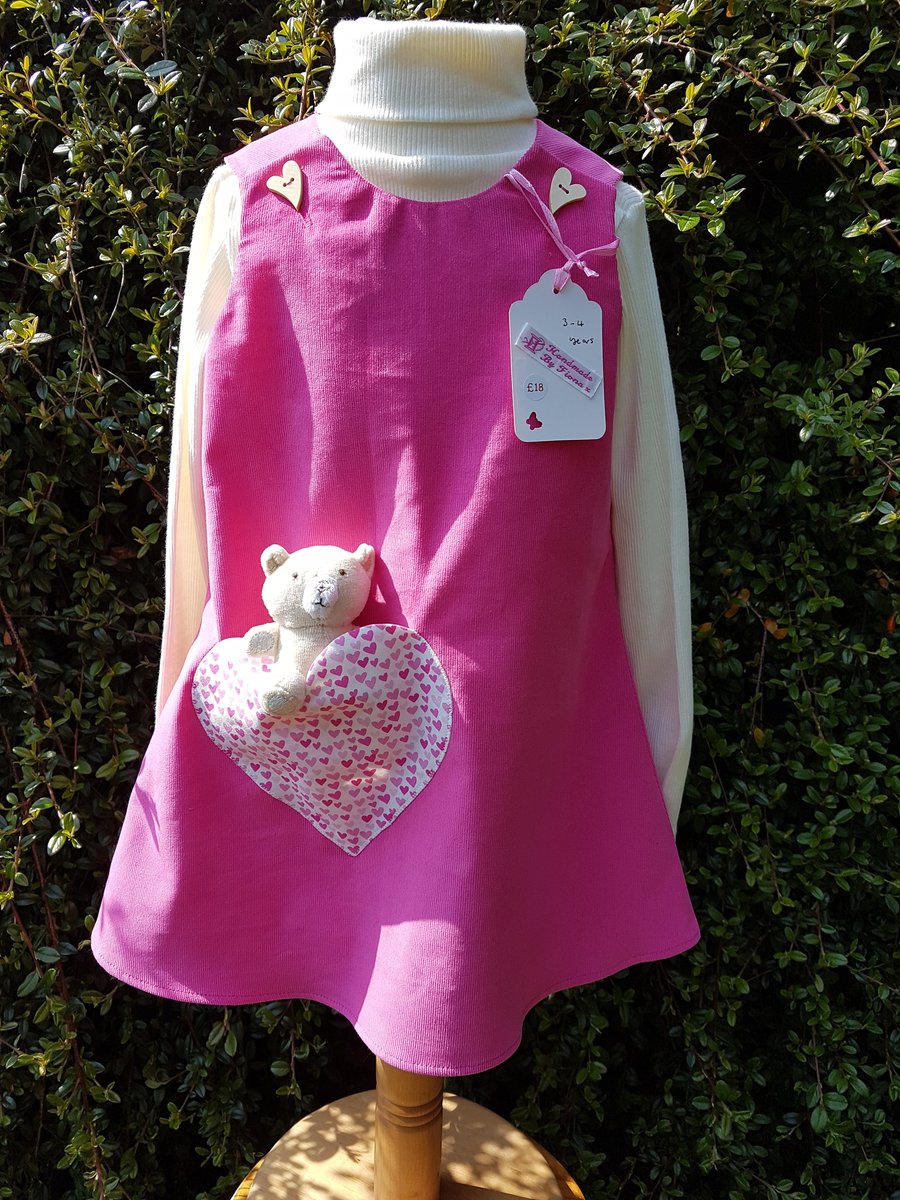 Age: 3-4y. Rose-pink baby needlecord pinafore dress. 