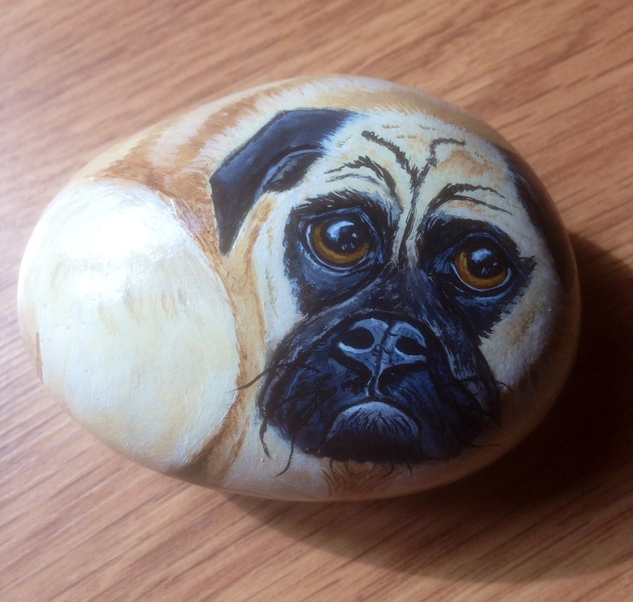Dog hand painted pet pug on rock stone 