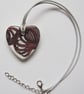 Filigree Artwork Design on Heart Shaped Ceramic Pendant on Grey Cord - Image 4