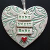 Green ceramic heart decoration Home Sweet Home.