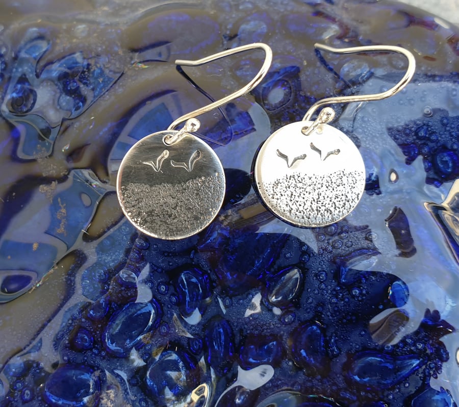 Silver beach themed earrings with seagulls