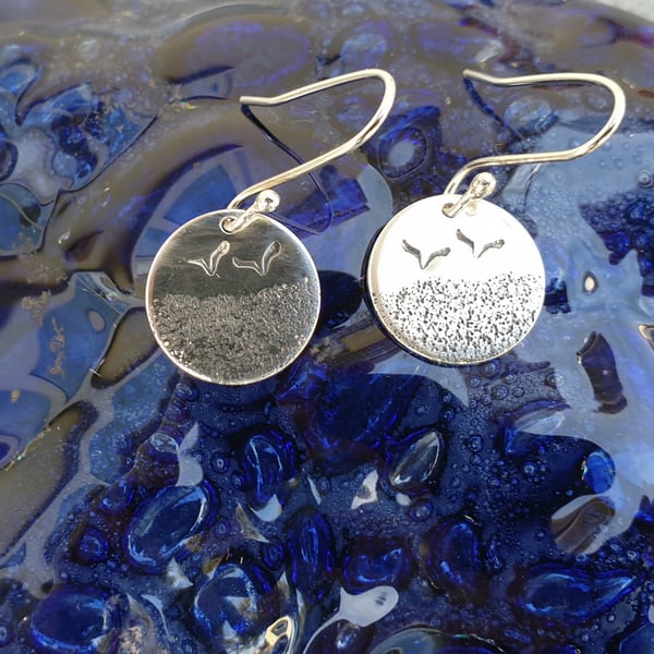 Silver beach themed earrings with seagulls