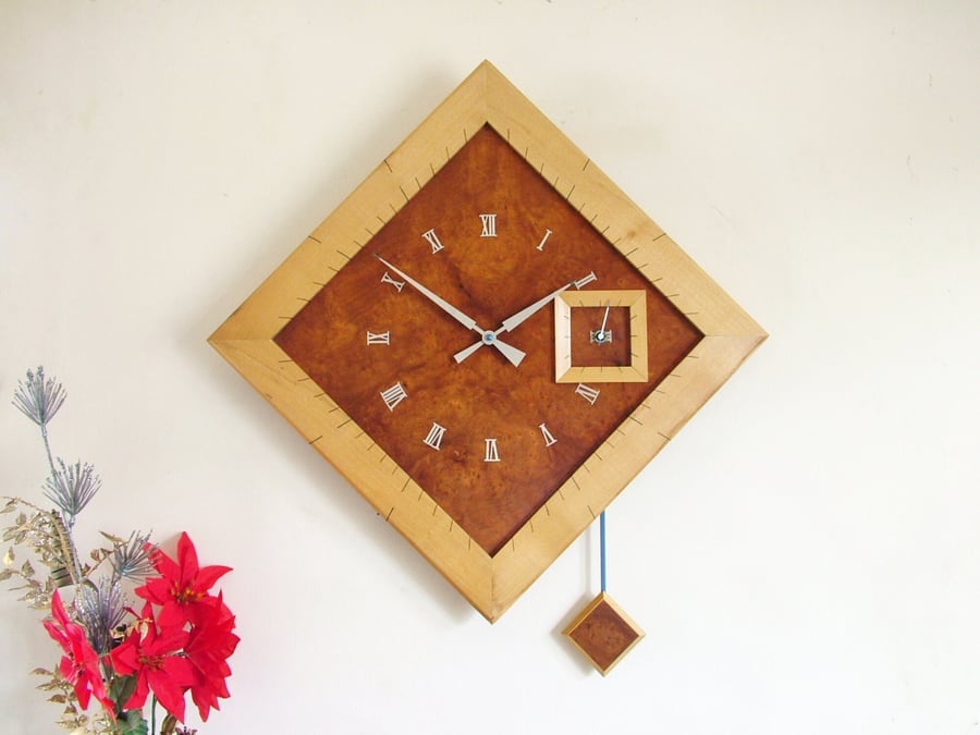 Large Diamond Pendulum Wall Clock, handmade in burr madrona and sycamore.