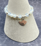 Stretchy bracelet with opalite stones and silver plated bird charm - Image 4
