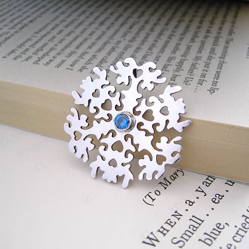 snowflake pendant with blue sapphire