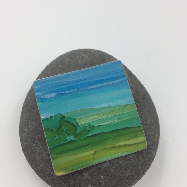 Hand painted anodised aluminium landscape brooch 