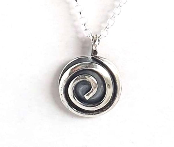 Single spiral silver pendant - celtic design